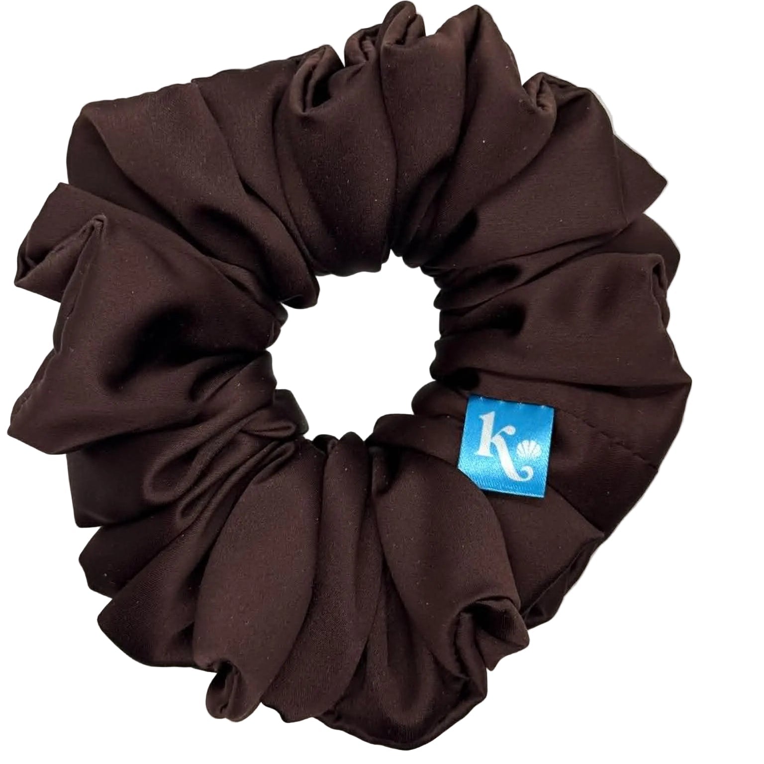 Brown scrunchie with a blue tag on a white background